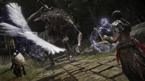 Player character casting a magical spell at a grotesque enemy while a summoned spirit fights alongside in Elden Ring.